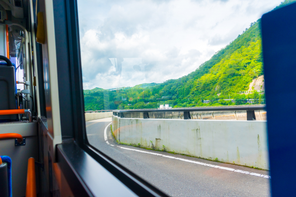 Sendai city bus entering Okura Dam to definition